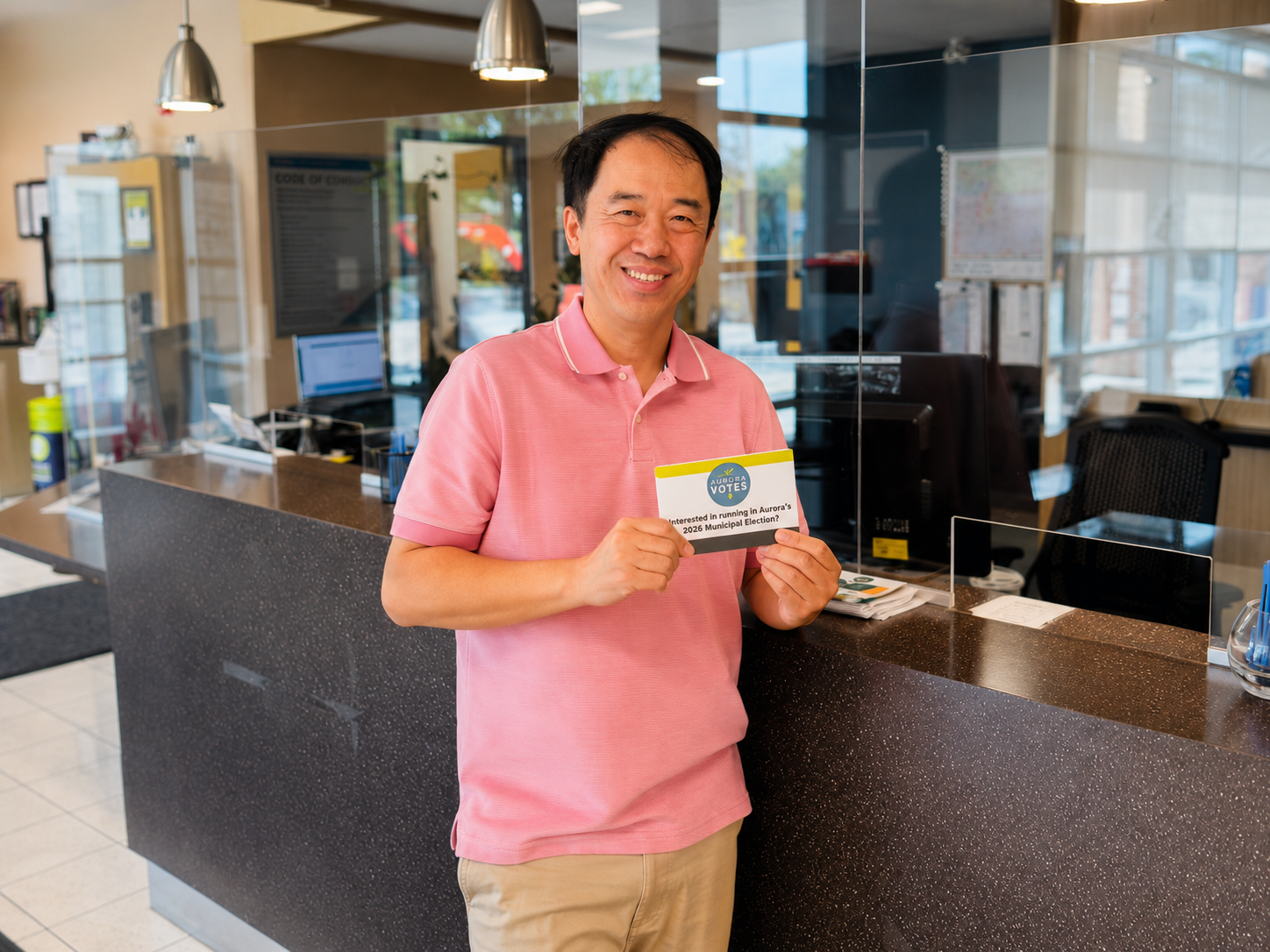 Terrence Zhu holding an Aurora Votes card for the 2026 Municipal Election in Aurora, Ontario